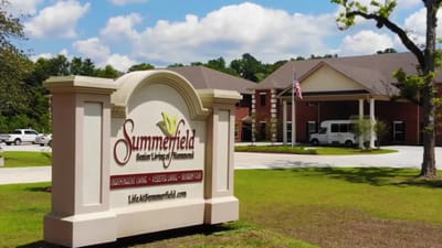 Exterior view of Summerfield Senior Living facility with signage