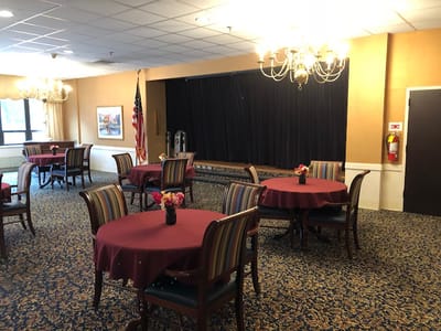 Interior view of a common area with round tables