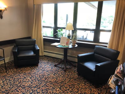 Cozy lounge area with armchairs and a table