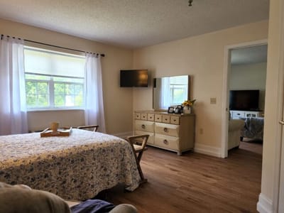 A cozy resident room with a bed and furniture