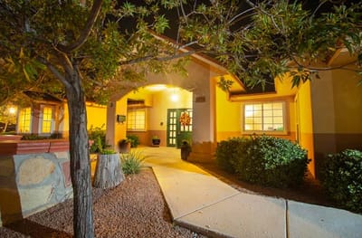 Front entrance of a senior living facility at night