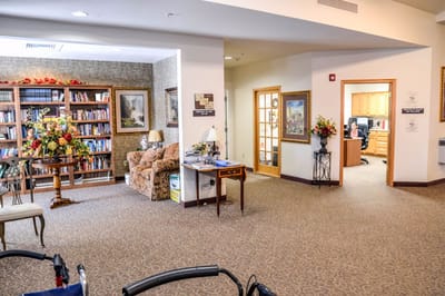 Interior view of a cozy common area with bookshelves
