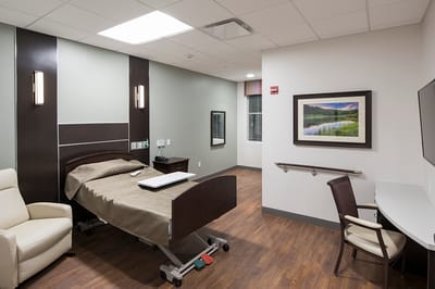 A comfortable private resident room in a nursing facility