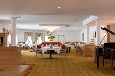 Elegant dining room with tables set for meals