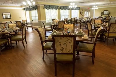Dining area with tables and chairs set for a meal