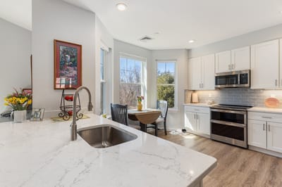 Bright kitchen area with modern appliances and natural light