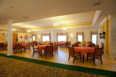 Dining room setup with tables and chairs