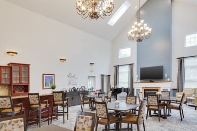 Bright common area with dining tables and chairs