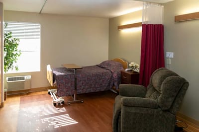 A cozy resident room with natural light