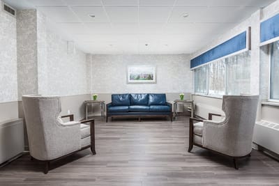 Bright common area with seating and soft lighting
