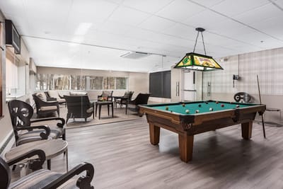 Interior common area with a pool table and seating