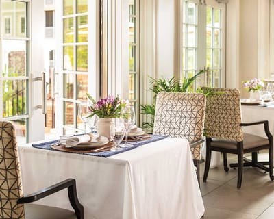 Elegant dining setup with flowers and table settings