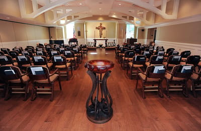 Interior view of a common area with chairs arranged for an event