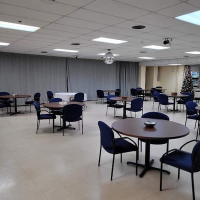 Interior view of a common area with tables and chairs
