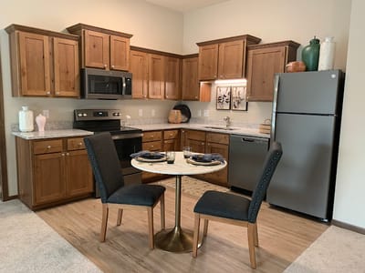 Cozy kitchen area with a round dining table and two chairs
