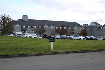 Exterior view of the facility with parking area