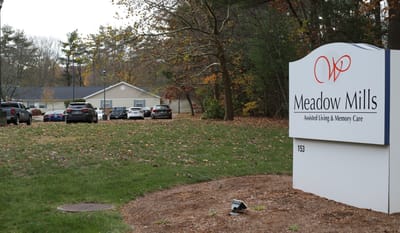 Exterior view of Meadow Mills with parking area