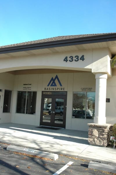 Exterior of a facility building with signage
