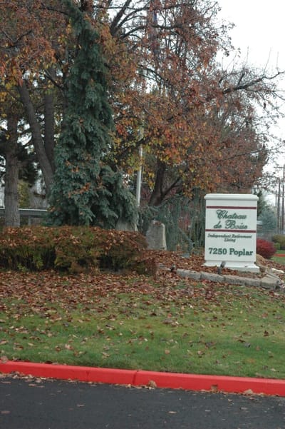 The building sign of Chateau de Boise surrounded by nature