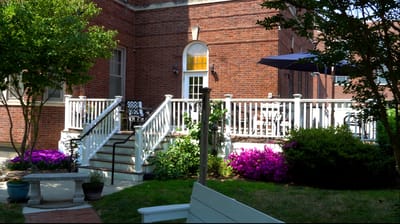 Outdoor garden area with flowers and seating