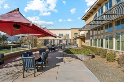 Outdoor patio area with seating and shade structures