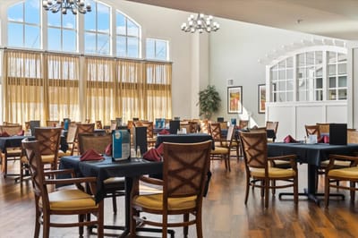 Dining area with tables and chairs in a bright space