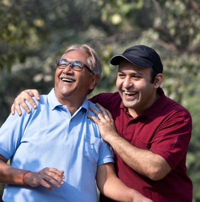 Two men enjoying a joyful moment outdoors