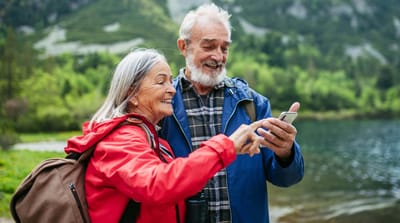 Seniors enjoying a moment by the lake