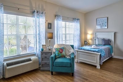 Cozy private resident room with bed and chair