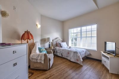 Cozy private room with a bed and seating area
