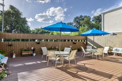 Outdoor patio area with umbrellas and seating