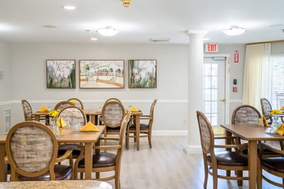 Bright dining room setup with tables and chairs