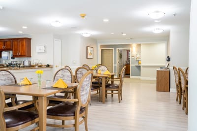 Dining area with tables set for residents
