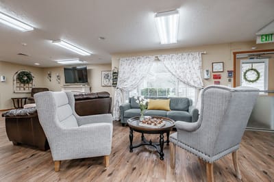 Cozy common area with armchairs and natural light