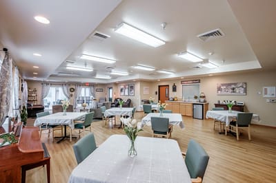 Interior view of a common area with dining tables