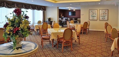 Interior view of a dining area with tables and chairs