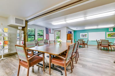 Interior view of a welcoming common area with tables and chairs