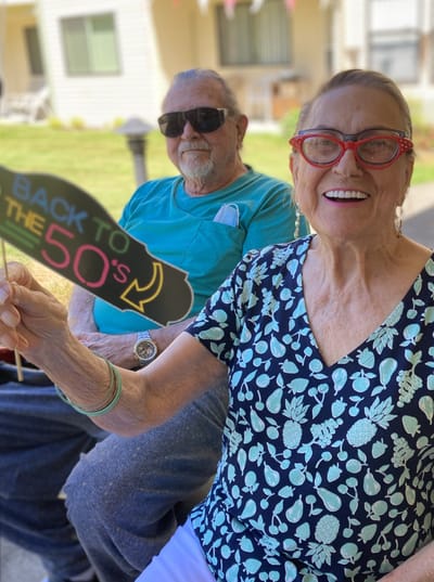 Residents enjoying a fun outdoor activity with retro theme