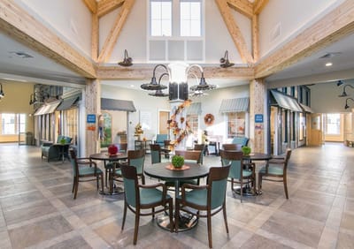 Bright common area with wooden beams and seating