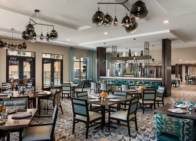 Elegant dining room with tables set for a meal