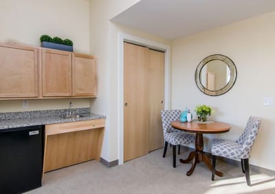 Cozy private room with kitchenette and dining area