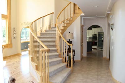 Bright interior with a staircase and light-colored walls