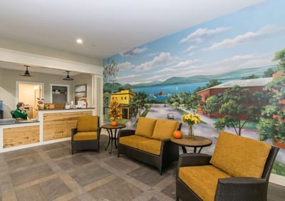 Bright common area with seating and mural