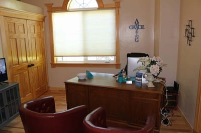 A small office space with a desk and decor