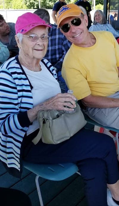 Senior resident enjoying an event with a visitor