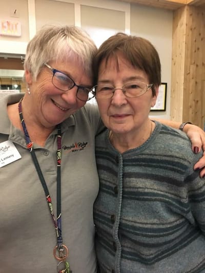 A staff member hugging a resident