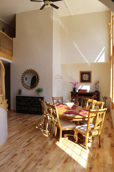 Bright dining area with wooden furniture and natural light