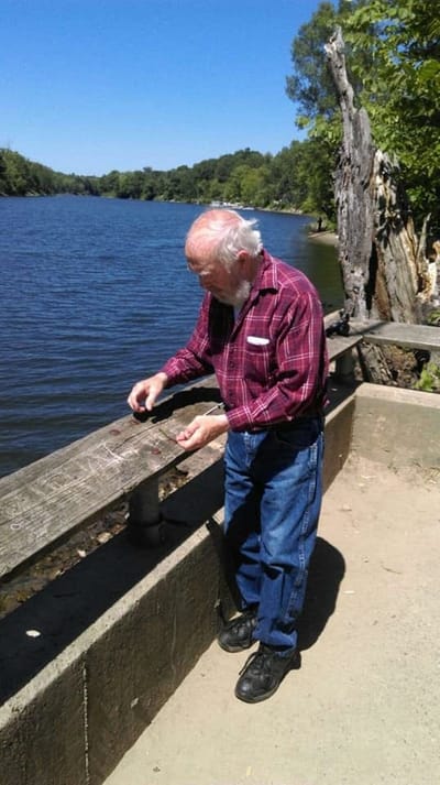 Senior resident enjoying nature by the river