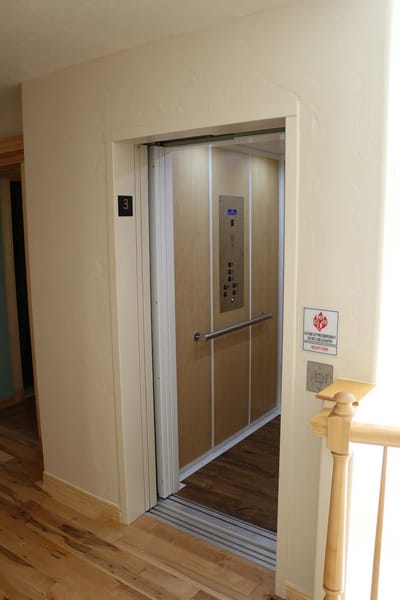 Elevator entrance in a senior living facility corridor