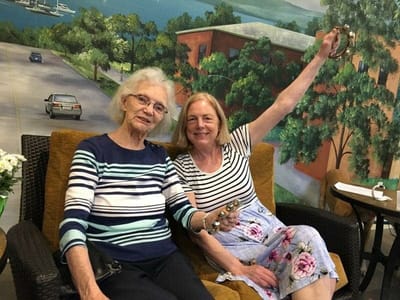 Two residents enjoying time together in a communal space